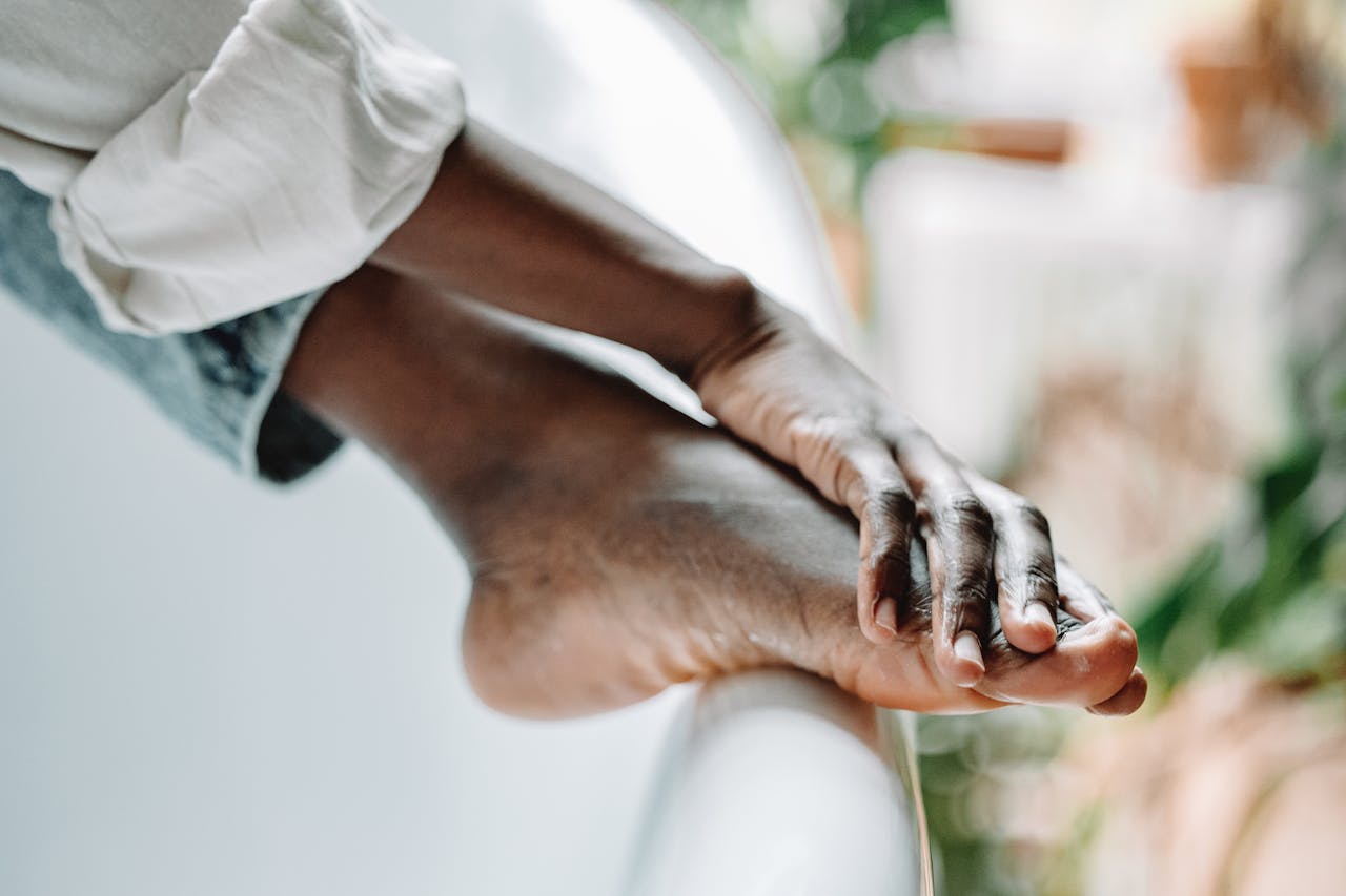Crafting Captivating Headlines: Your awesome post title goes here Close-up of a person's feet resting on a bathtub edge, conveying relaxation and self-care.